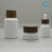 white coating inclined shoulder glass cosmetic packaging lotion bottle and cream jar series with ash wood screw lids