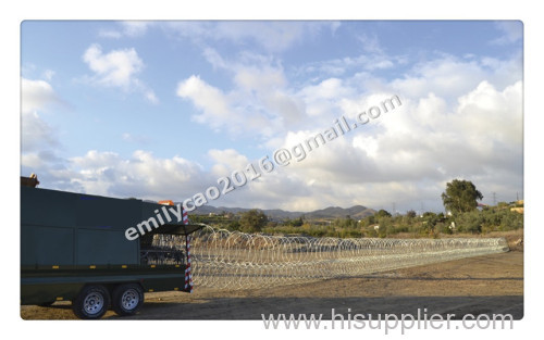 Mobile security razor barrier trailer