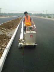 Hand-push thermoplastic road marking machine