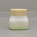 Empty cosmetic opal glass jar wooden lid