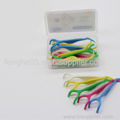 Green and white Y-shape dental floss pick