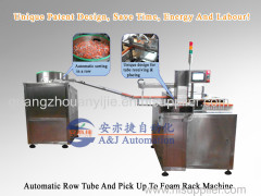 Automatic row tube and pick up to foam rack machine