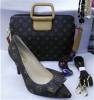 Bowtie high heel shoes and matched handbag