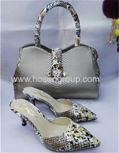 Silver high heel pointed toe shoes with matching handbag