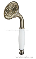 bronze brass hand shower with white ceramic handle