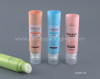 Cosmetic tubes with silicone massage brushes