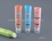 Cosmetic tubes with silicone massage brushes