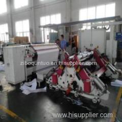Biaxial center surface slitting and rewinding machine