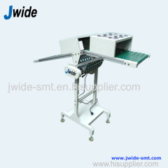 DIP wave outfeed conveyor for plug in lines
