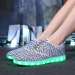 Charcoal fly knitting shoes with LED lights manufactor