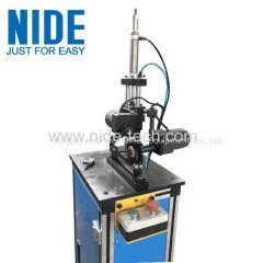 Electric motor rotor commutator deburring machine with brush