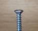 Self tapping screw - oval raised head - cross phillip drive - zinc coated