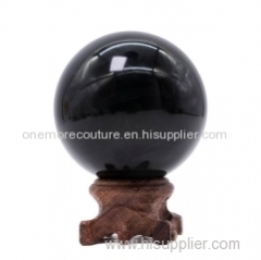 Polished black crystal obsidian sphere ball for healing