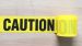 Caution Tape Yellow Background with Black "Caution" Words Printing