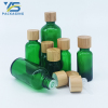 Transparent green empty glass bottle with bamboo screw cap