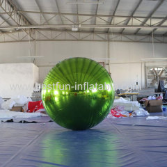 large inflatable ball with mirrored or reflective surfaces typically used for parties and dance events