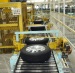 Tire conveying and caging line