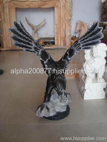 Hand carved stone eagle statue