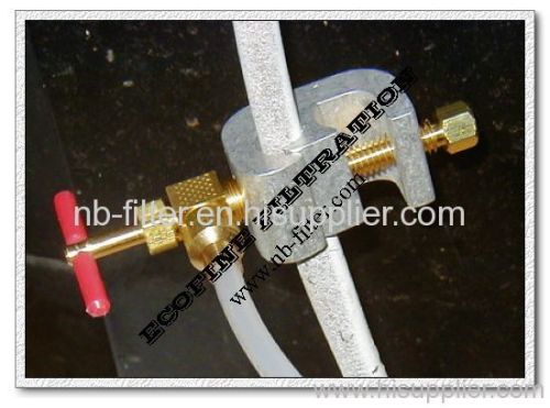 Piercing saddle valve