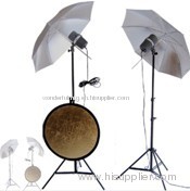 photographic umbrella with light stands and studio reflector discs.