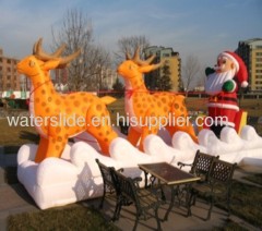 Reindeer with inflatable Christmas Santa Claus