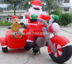 Reindeer with inflatable christmas father on moto
