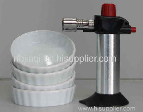 Creme brulee torch with 4 white procelain bowls