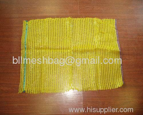 Yellow raschel mesh bag for potato, onion, carrot