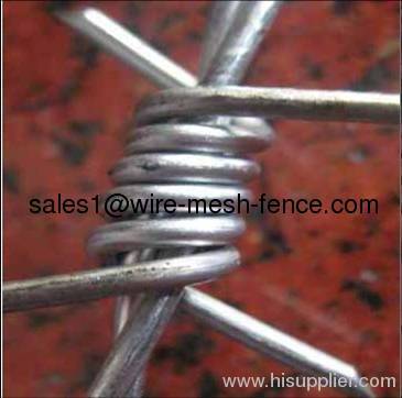 bright galvanized barbed wire fence