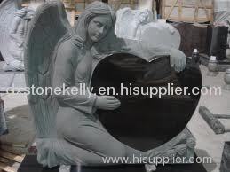 Black granite tombstone with angel