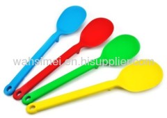 Colourful silicon kitchen soup spoons