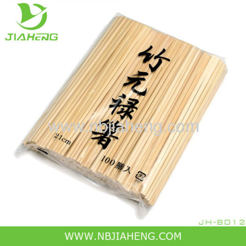 Natural bamboo chopsticks wrapped with open paper bag