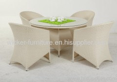 Garden round wicker dining table and chairs