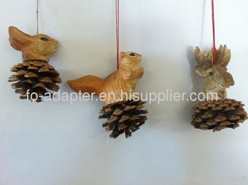 Hand carved wooden animal head on pine cone