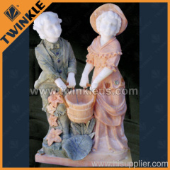boy and girl stone sculpture
