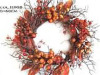 decorative autumn wreath with red berry and maple leaves