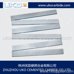 Tungsten carbide wear strips for wood cutting