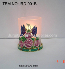 Metal candle holder with colorful flowers