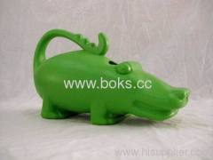 green plastic watering can