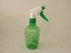 green transparent plastic spray bottles
