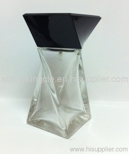 clear glass bottle with black cap