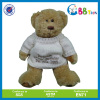 teddy bear stuffed toy in white sweater