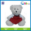 bear stuffed toy in red skirt