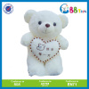 lovely teddy bear holding a heart