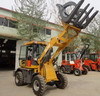 compact wheel loader with grass grapple