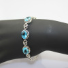 Fashion Jewelry 9x11mm Oval Cut Created Blue Topaz and Clear Cubic Zircon Link Bracelet