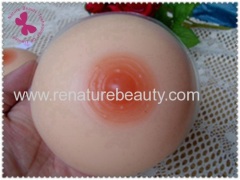 Round shaped silicone artificial breast for men