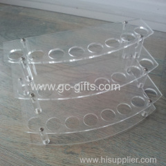 Arc progression of transparent acrylic display rack