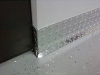 Diamond plate baseboard protecting your wall from stains