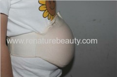 Being mother tested with silicon artificial pregnancy belly